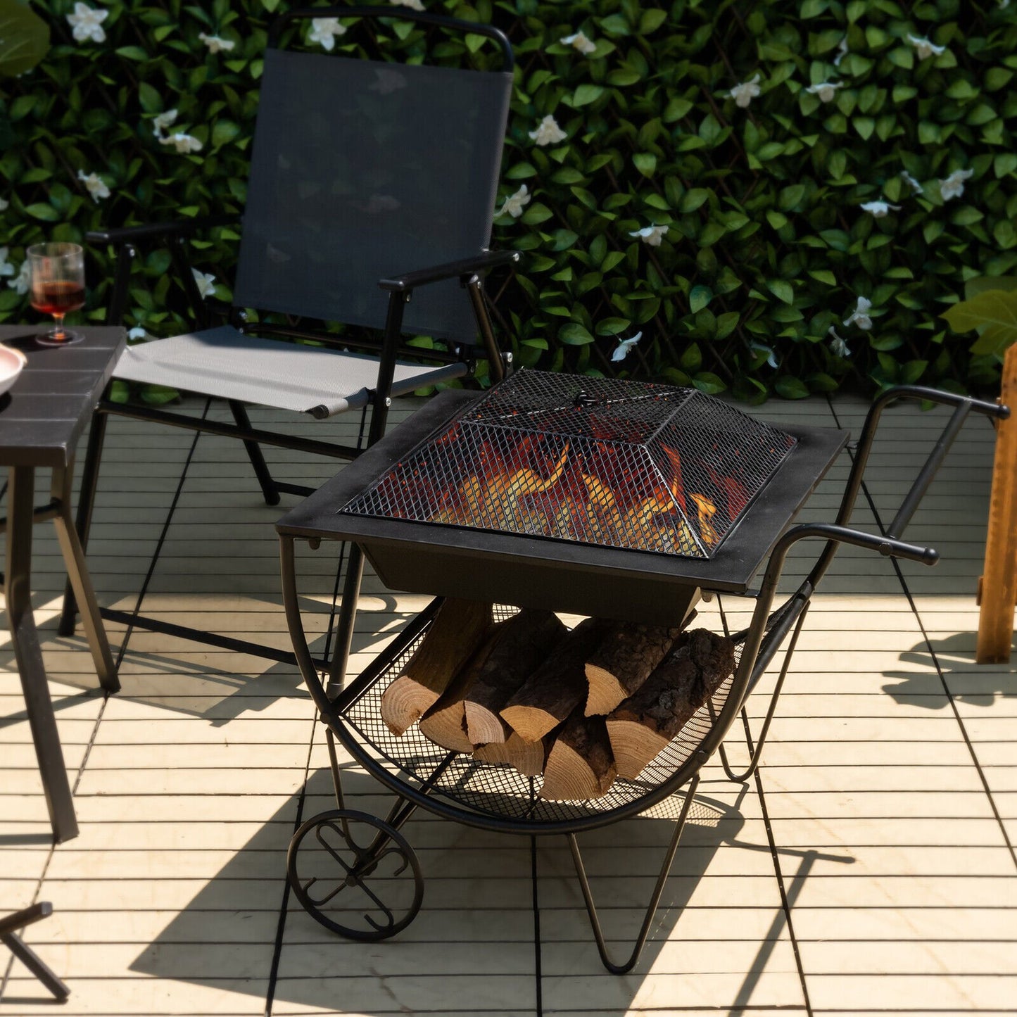 Outdoor Wood Burning Fire Pit with Log Storage Rack and Wheels, Black Fire Pits   at Gallery Canada