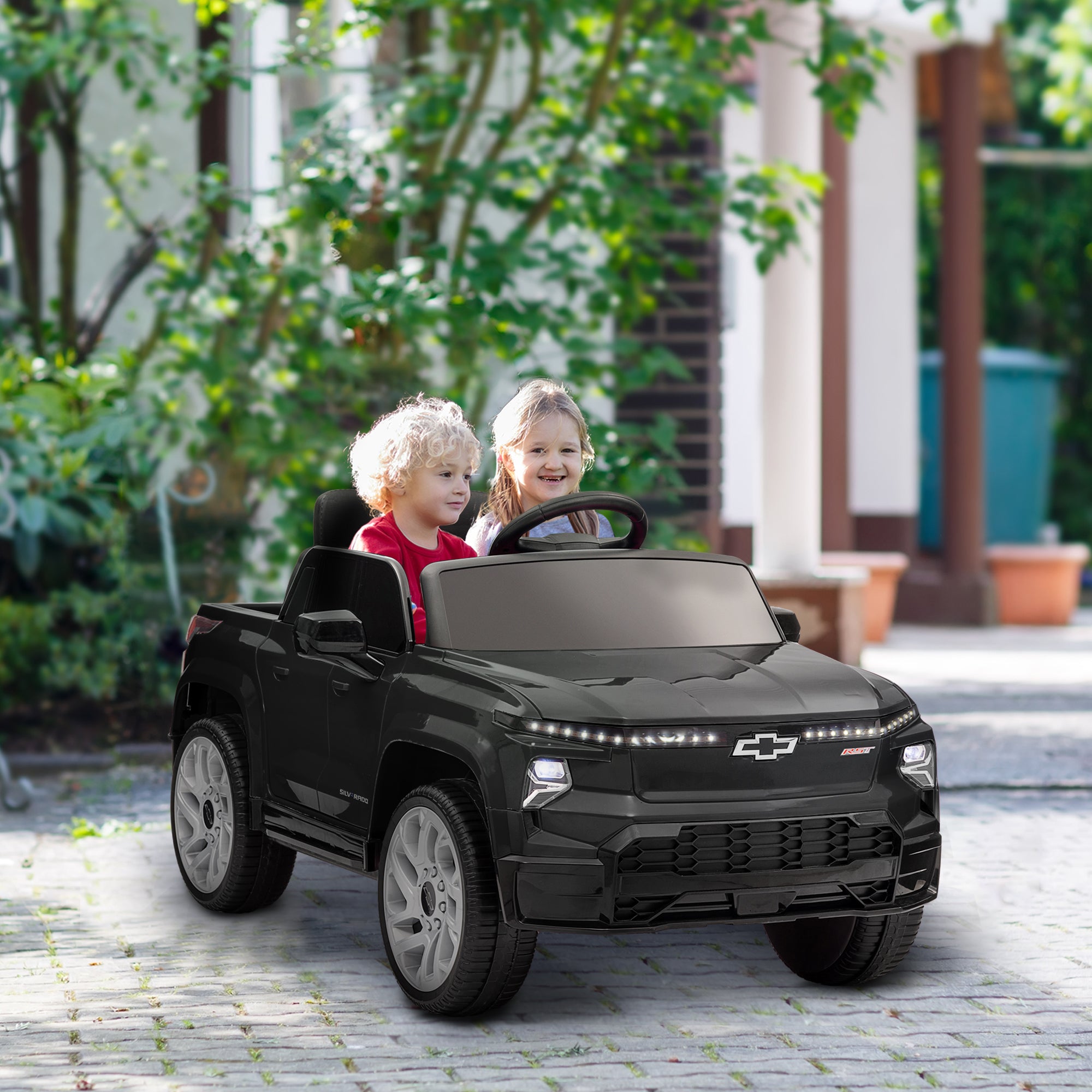 12V CHEVROLET SILVERADO EV RST Licensed Kids Car w/ Remote, Spring Suspension, Soft Start, Training Wheels, Black Electric Toy Cars   at Gallery Canada