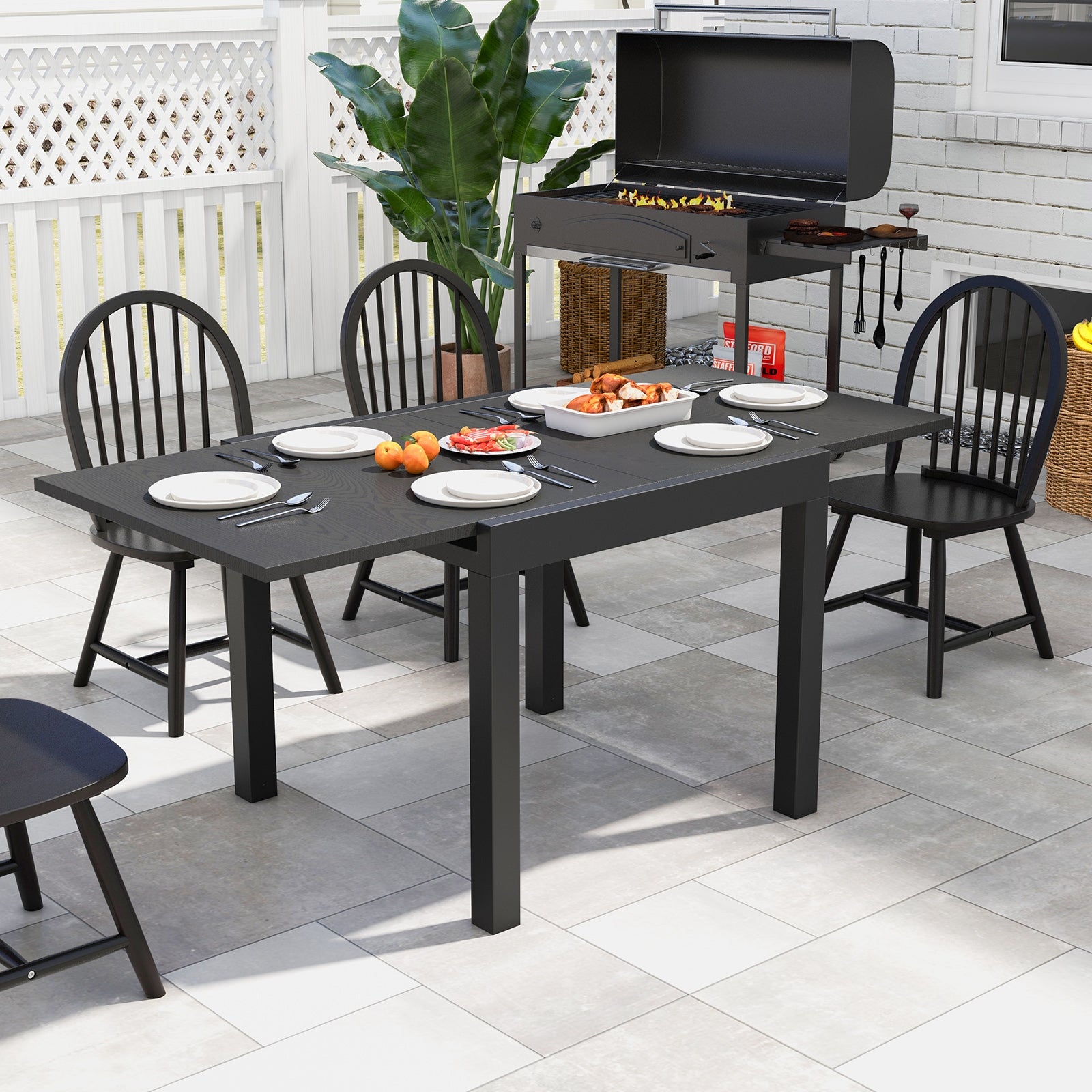 31.5 inches-63 inches Adjustable Patio Expandable Dining Table for 4-6 Person, Gray Dining Tables   at Gallery Canada